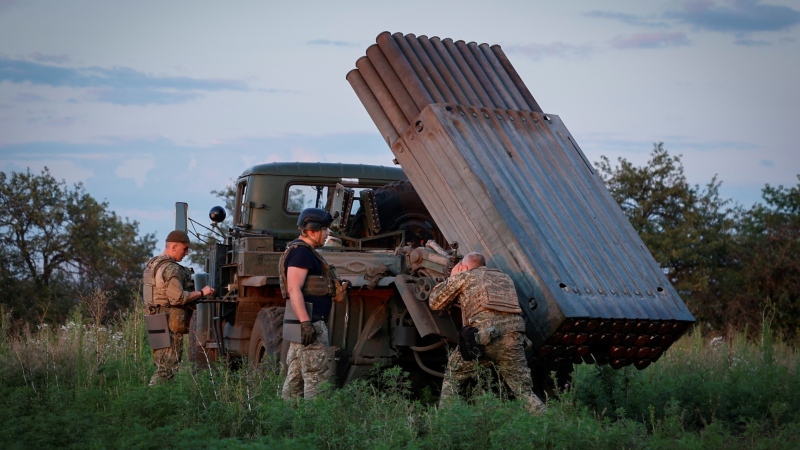 Ukrainian soldiers prepare a Grad multiple rocket launcher to fire rockets at the Russian positions in the frontline near Bakhmut, Donetsk region, Ukraine, Wednesday, July 12, 2023. (Roman Chop via AP)