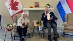 Sonja Jobes, left, and Roly Armitage speak at a reunion in Ottawa. Aug. 14, 2023. Armitage saved Jobes from a ditch in Holland in 1944 during the Second World War and finally reunited with her.