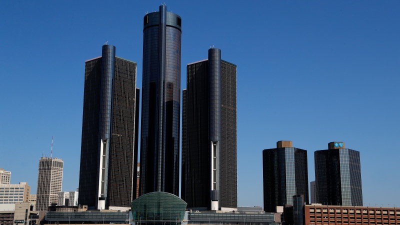 This May 12, 2020, file photo, shows a general view of the Renaissance Center, headquarters for General Motors, along the Detroit skyline from the Detroit River. (AP Photo/Paul Sancya)