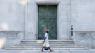 A man walks past the Bank of Canada building, Wednesday, September 6, 2023, in Ottawa. THE CANADIAN PRESS/Adrian Wyld
