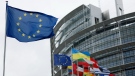 The European flag, left, flies April 18, 2023, at the European Parliament in Strasbourg, eastern France. (AP Photo/Jean-Francois Badias, File)