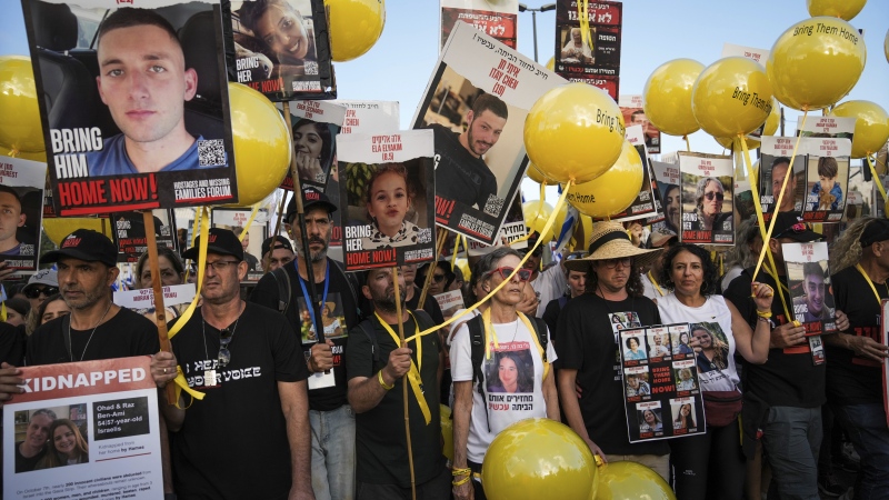 Family and supporters of the estimated 240 hostages held by Hamas in Gaza complete the final leg of a five-day solidarity rally calling for their return, from Tel Aviv to the Prime Minister's office in Jerusalem, Saturday, Nov. 18, 2023. (AP Photo/Mahmoud Illean)