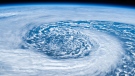 The image is a 'digital enhancement' of a NASA image of a hurricane's formation. (Getty Images / Roberto Machado Noa)