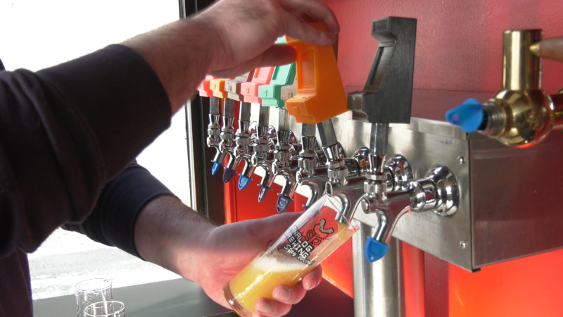 A staffer at Edmonton's Analog Brewing pulls a glass of beer on Jan. 9, 2024. (Evan Klippenstein/CTV News Edmonton)