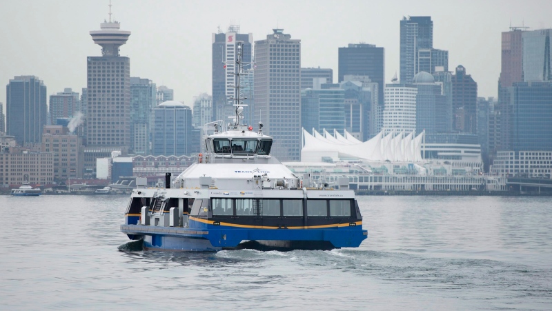 Downtown Vancouver is pictured in the background as a TransLink SeaBus leaves North Vancouver, B.C., Wednesday, Feb. 4, 2015.  THE CANADIAN PRESS/Jonathan Hayward