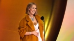 Celine Dion presents the award for album of the year during the 66th annual Grammy Awards, Feb. 4, 2024, in Los Angeles. (AP Photo/Chris Pizzello)