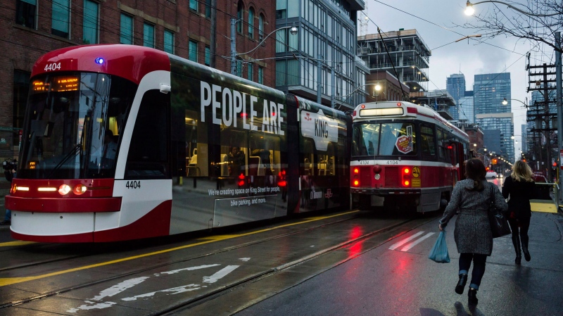 Streetcars are pictured along King Street in downtown Toronto. (THE CANADIAN PRESS/Christopher Katsarov) 