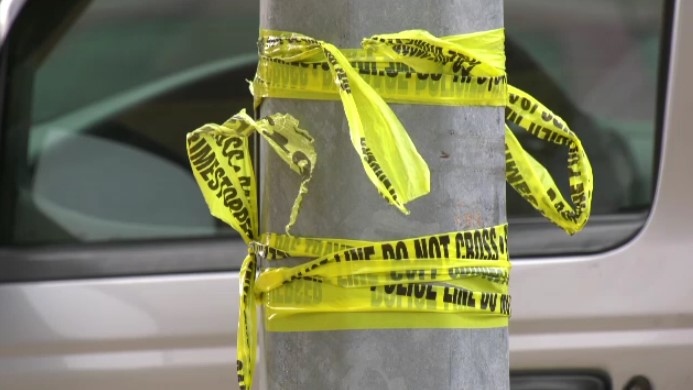 Police tape wrapped around on a pole in Winnipeg on March 15, 2024. (Jeff Keele/CTV News Winnipeg)