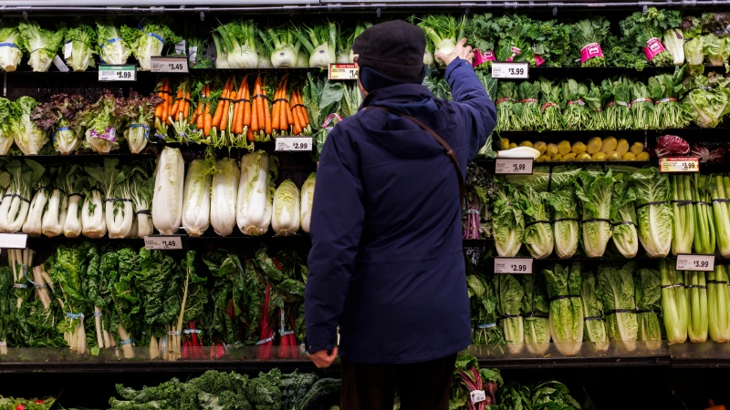 A customer shops for produce at a grocery store In Toronto on Friday, Feb. 2, 2024. THE CANADIAN PRESS/Cole Burston
