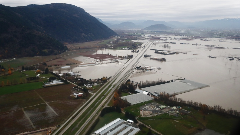 Flooded farms are seen along the Trans-Canada Highway in this aerial photo in Abbotsford, B.C., on Monday, November 22, 2021. THE CANADIAN PRESS/Darryl Dyck