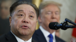 Broadcom CEO Hock Tan speaks as then-U.S. president Donald Trump listens during an event on Nov. 2, 2017 in Washington. (AP Photo/Evan Vucci, File)