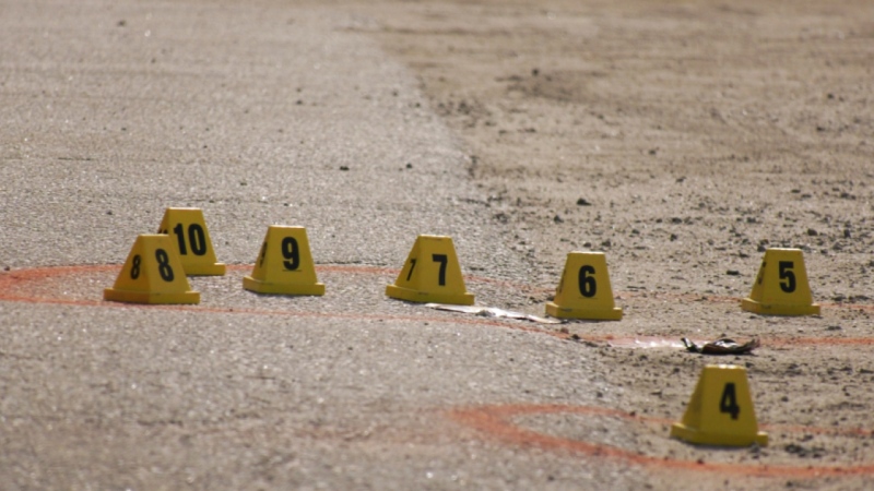 Police markers are seen Wednesday at the crime scene. A 19-year-old was taken to hospital after the 2 a.m. shooting on the property of Holy Cross Catholic Elementary School. (Eric Taschner/CTV News)