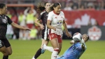 Canada's Olivia Smith takes the ball past Mexico goalkeeper Esthefanny Barreras during second half International friendly action in Toronto, on Tuesday, June 4, 2024. THE CANADIAN PRESS/Chris Young