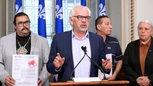 Assembly of first Nations Quebec-Labrador chief Ghislain Picard releases a report card on the Coalition Avenir Quebec government relations , at the legislature in Quebec City, Wednesday, June 5, 2024. Chiefs Sipi Flamand, left, and Real MacKernzie, right, stand behind. Quebec Solidaire MNA Manon Masse, right, looks on. THE CANADIAN PRESS/Jacques Boissinot