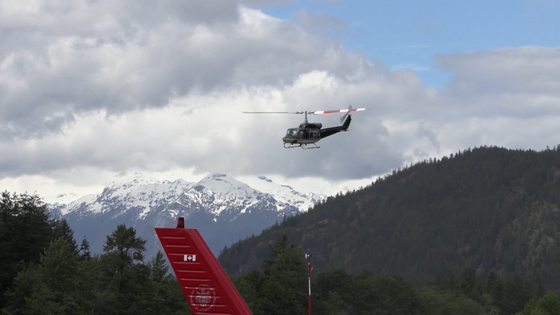 A helicopter takes off as crews search for three missing mountaineers near Squamish, B.C., on June 5, 2024. 