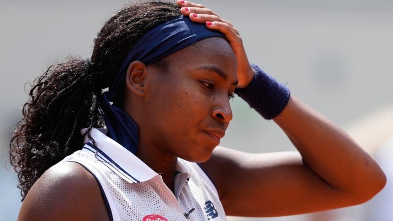 Coco Gauff of the U.S. reacts after missing a shot against Poland's Iga Swiatek during their semifinal match of the French Open tennis tournament at the Roland Garros stadium in Paris, Thursday, June 6, 2024. (Thibault Camus / AP Photo)