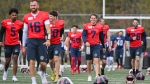 Montreal Alouettes quarterback Cody Fajardo (7) and teammates run drills during CFL football training camp in Saint-Jerome, Que., Sunday, May 12, 2024. (Graham Hughes, The Canadian Press)
