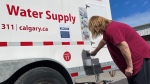 Bowness residents are able to bring empty jugs and bottles to one of four emergency water trucks to collect potable water for use in their homes.
