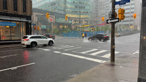A downpour in Ottawa at the corner of Albert and Metcalfe streets. June 6, 2024. (Josh Pringle/CTV News Ottawa)
