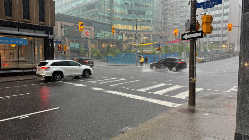 A downpour in Ottawa at the corner of Albert and Metcalfe streets. June 6, 2024. (Josh Pringle/CTV News Ottawa)