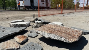 Pieces of a 78-inch water main lay on the ground on June 6, 2024 near the site where Calgary's main feeder line broke on Wednesday.