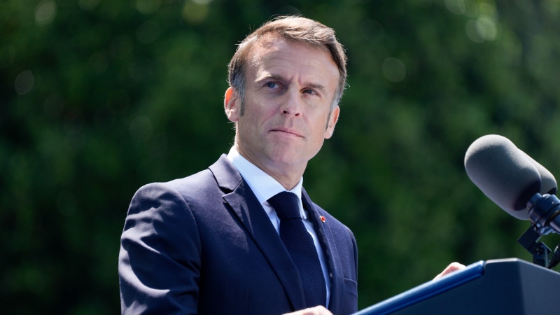 French President Emmanuel Macron speaks during a ceremony to mark the 80th anniversary of D-Day, Thursday, June 6, 2024, in Normandy. (AP Photo/Evan Vucci) 