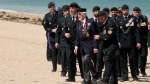 Canadian veteran William Seifried walks off Juno Beach on the 80th anniversary of D-Day in Courseulles-sur-Mer, Normandy, France, Thursday, June 6, 2024. THE CANADIAN PRESS/Adrian Wyld