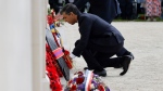 Britain's Prime Minister Rishi Sunak lays a wreath at the World War II British Normandy Memorial of Ver-sur-Mer, Thursday, June 6, 2024.  (Ludovic Marin/Pool via AP)