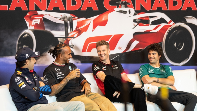 Haas driver Nico Hulkenberg of Germany, second right, laughs with fellow drivers from L-R, Red Bull Racing driver Sergio Perez, Mercedes driver Lewis Hamilton of Great Britain and Aston Martin driver Lance Stroll of Canada, during the drivers' press conference at the Canadian Grand Prix Thursday, June 6, 2024 in Montreal. (Christinne Muschi, The Canadian Press)