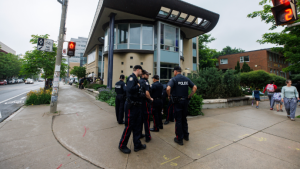 Toronto Police officers stand outside on the street near a press conference called by Canadian Jewish organizations in Toronto, June 3, 2024. THE CANADIAN PRESS/Cole Burston

