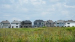 A row of new homes is pictured in Ottawa on Monday, Aug. 14, 2023. (Sean Kilpatrick/THE CANADIAN PRESS)
