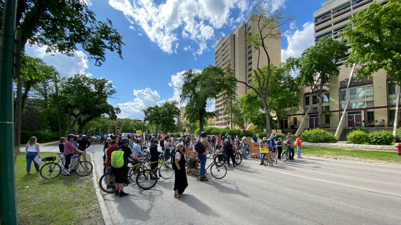 Cyclists gather for a rally on Wellington Crescent on June 7, 2024 in Winnipeg. The cyclists were rallying in the wake of a hit-and-run death of a 61-year-old cyclist on June 6, 2024. (Danton Unger/CTV News Winnipeg)