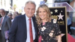 Pat Sajak, left, and Vanna White, from 'Wheel of Fortune,' attend a ceremony honoring Harry Friedman with a star on the Hollywood Walk of Fame in Los Angeles on Nov. 1, 2019. (Photo by Richard Shotwell / Invision / AP, File)