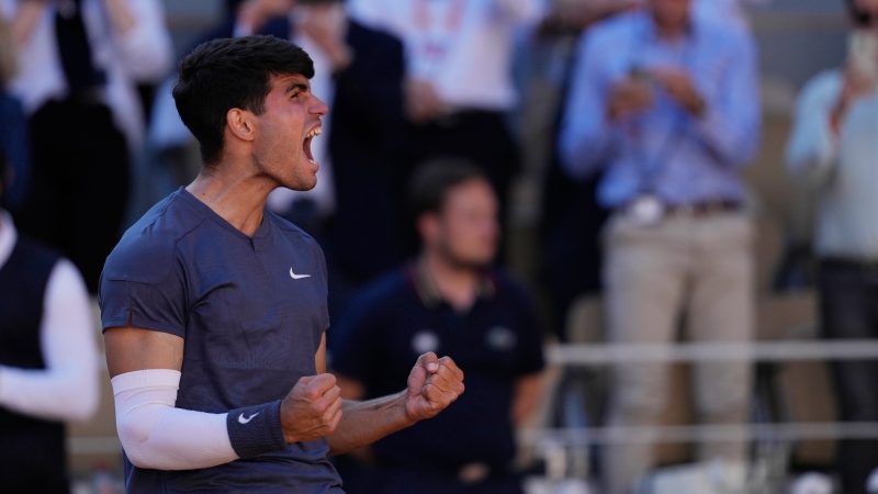 Spain's Carlos Alcaraz celebrates as he won the semifinal match of the French Open tennis tournament against Italy's Jannik Sinner at the Roland Garros stadium in Paris, Friday, June 7, 2024. (Thibault Camus / AP Photo)