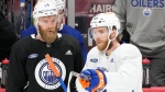 Edmonton Oilers centre Connor McDavid, right, and defenceman Mattias Ekholm on June 7, 2024, during practice in Sunrise, Fla. The Oilers take on the Florida Panthers in Game 1 of the Stanley Cup Final on Saturday in Sunrise. (Wilfredo Lee/Associated Press)