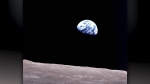 This Dec. 24, 1968, file photo made available by NASA shows the Earth behind the surface of the moon during the Apollo 8 mission. Retired Maj. Gen. William Anders, the former Apollo 8 astronaut who took the iconic 'Earthrise' photo showing the planet as a shadowed blue marble from space in 1968, was killed Friday, June 7, 2024, when the plane he was piloting alone plummeted into the waters off the San Juan Islands in Washington state. He was 90. (William Anders/NASA via AP, File)