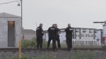 Winnipeg Police investigate the scene after a man was hit by a train near Concordia Avenue East and Peguis Street on June 8, 2024. (Glenn Pismenny/CTV News Winnipeg)