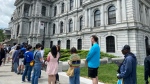 Long lines of visitors are shown at Montreal’s City Hall on Saturday June 8, 2024. City Hall has reopened its doors to the public today after five years worth of renovations that took longer than expected and ran over budget. (Joe Bongiorno, The Canadian Press)