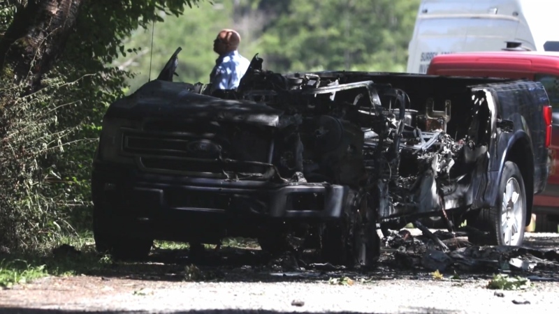 A torched vehicle is seen on McMillan Road near 20 Avenue in Surrey on Friday, June 7. 