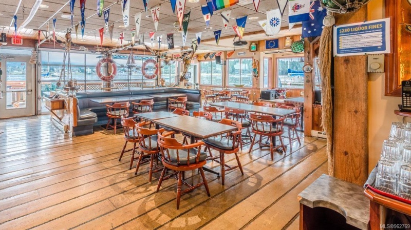 This photo shows the interior of the Dinghy Dock, Canada's only floating pub. (Credit: realtor.ca) 