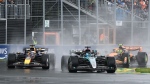 Mercedes driver George Russell, of the United Kingdom, leads Red Bull Racing driver Max Verstappen, of the Netherlands, and McLaren driver Lando Norris, of the United Kingdom, through the first turn at the Canadian Grand Prix in Montreal, Sunday, June 9, 2024. THE CANADIAN PRESS/Graham Hughes