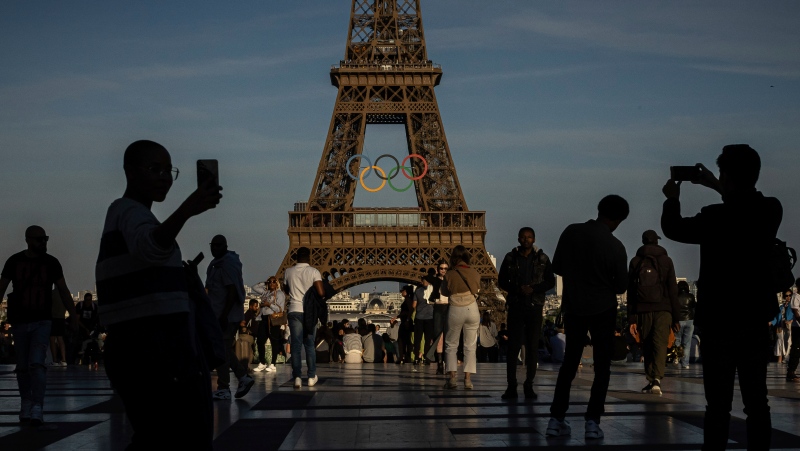 The Olympic rings are seen on the Eiffel Tower Friday, June 7, 2024 in Paris. The Paris Olympics organizers mounted the rings on the Eiffel Tower on Friday as the French capital marks 50 days until the start of the Summer Games. (AP Photo/Aurelien Morissard)