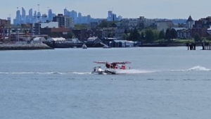 Video captured by Tom Adrion and shared on Storyful shows the moment a float plane and a recreational boat collided in Vancouver's Coal Harbour. (Tom Adrion/Storyful)