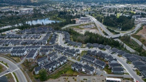Townhouses and houses are seen in an aerial view at a new housing development in Langford, B.C., Thursday, May 30, 2024. THE CANADIAN PRESS/Darryl Dyck