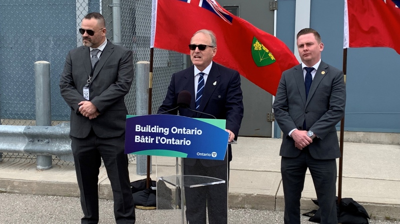 Chad Oldfield, OPSEU Ministry Employee Relations Committee co-chair, Graham McGregor, parliamentary assistant to the Solicitor General, and Solicitor General Michael Kerzner, on June 10, 2024. (Bryan Bicknell/CTV News London) 