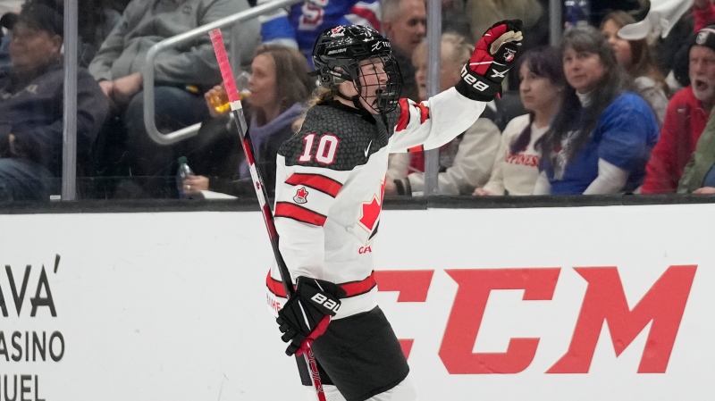 Canada forward Sarah Fillier (10) waves after scoring during the second period of a Rivalry Series hockey game against the United States Monday, Dec. 19, 2022. (Ashley Landis/AP Photo)