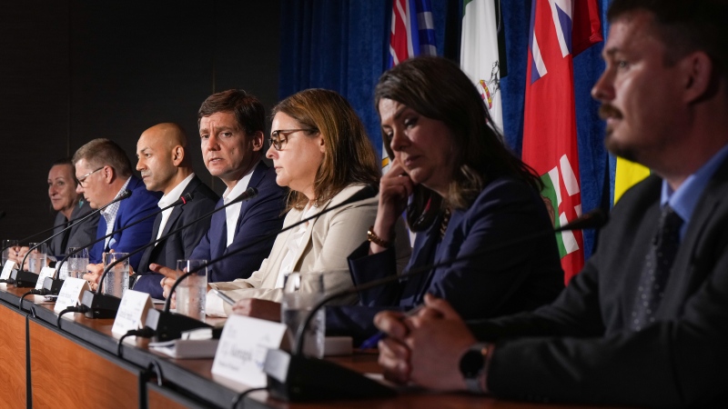 British Columbia Premier David Eby, fourth from the left, speaks as other premiers listen during a news conference after a meeting of western premiers, in Whistler, B.C., on Tuesday, June 27, 2023. Premiers from across Western Canada are wrapping up meetings in Whitehorse today aimed at discussing common concerns in the region. THE CANADIAN PRESS/Darryl Dyck