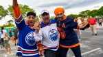 Edmonton Oilers fans Ranvir Chana, Manny Dhinsa and Satwant Virdee, from left, arrive for Game 1 of the NHL hockey Stanley Cup Finals between the Florida Panthers and the Oilers on Saturday, June 8, 2024, in Sunrise, Fla. (Michael Laughlin / AP Photo)