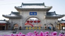 Tourists walk past a gateway with the name “Beishan” seen at the Beishan Park in northeastern China’s Jilin province on Jan 23, 2020. Four instructors from Iowa’s Cornell College teaching at Beihua University in northeastern China were attacked in the Beishan public park, reportedly with a knife, officials at the U.S. school and the State Department said Tuesday, June 11, 2024. (Zhu Wanchang/CNS Photos via AP)
