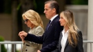 Hunter Biden, accompanied by his mother, first lady Jill Biden, left, and his wife, Melissa Cohen Biden, right, walking out of federal court after hearing the verdict, Tuesday, June 11, 2024, in Wilmington, Del. (AP Photo/Matt Rourke)